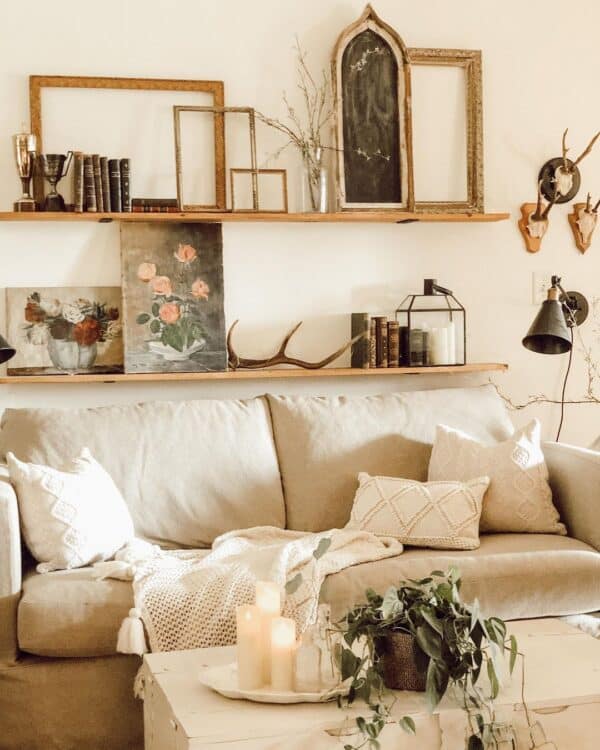 Carefully Accessorized Floating Shelves Above Couch 600x750 