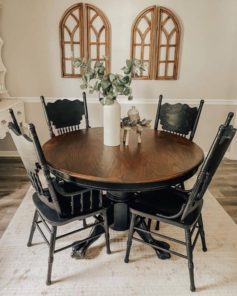 A Black and Wood Table With Black Wooden Dining Chairs - Soul & Lane