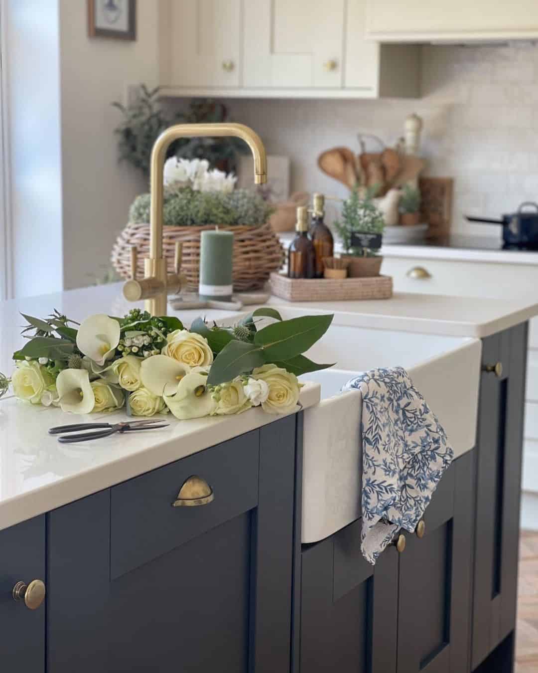https://www.soulandlane.com/wp-content/uploads/2022/09/White-Roses-Laid-Near-a-Brass-Kitchen-Faucet.jpg