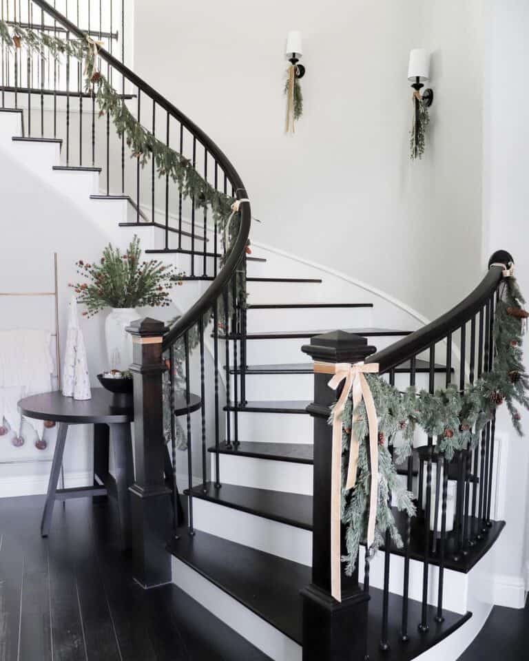 Curved Stairwell with White Stair Skirt Trim