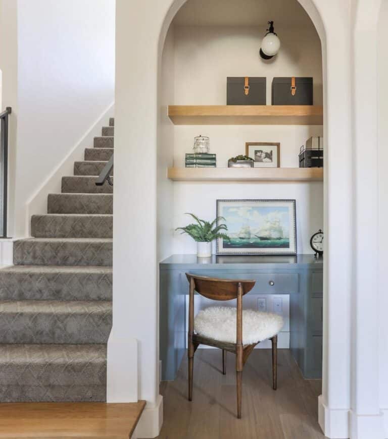 Gray Carpeted Staircase with White Skirt Board