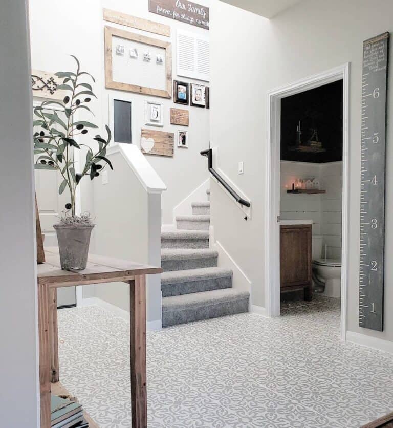 Gray Carpeted Stairwell with White Skirt Board