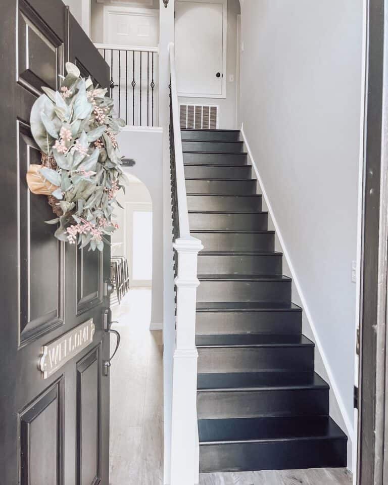 White Skirt Board Stairway with Black Steps