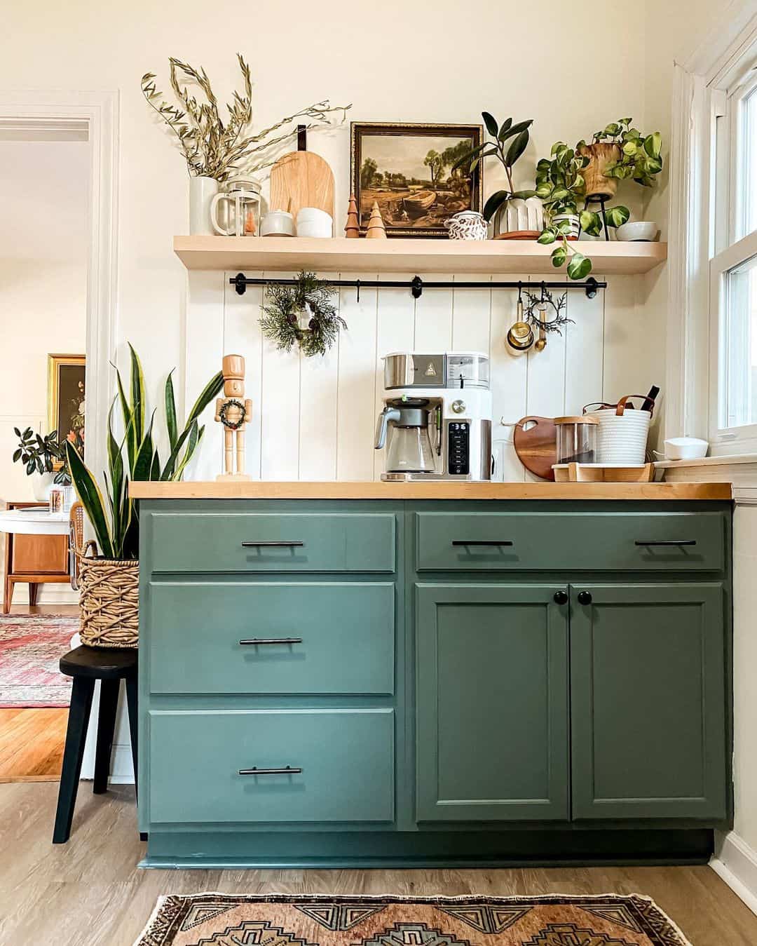 https://www.soulandlane.com/wp-content/uploads/2022/10/Wooden-Nutcracker-on-Sage-Green-Kitchen-Cabinets.jpg