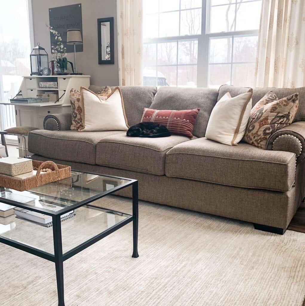 https://www.soulandlane.com/wp-content/uploads/2022/11/Grey-Couch-with-Red-Brown-and-White-Throw-Pillows-1021x1024.jpg
