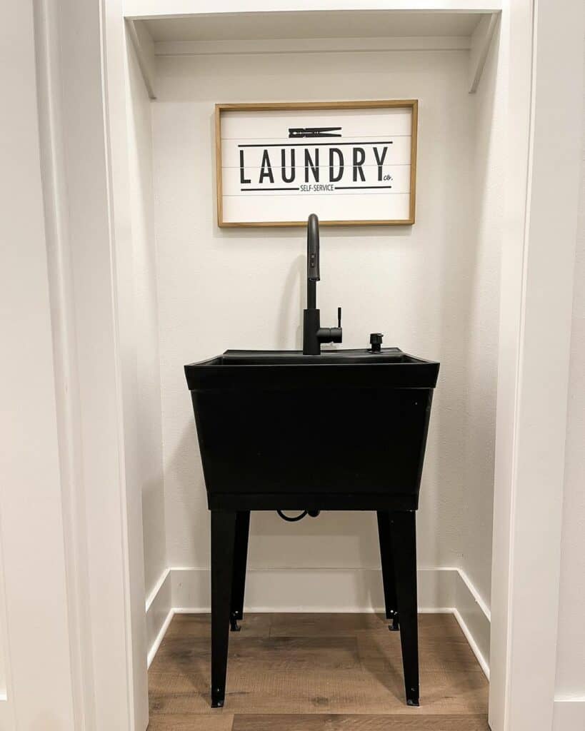 Black Utility Sink in Laundry Room Closet