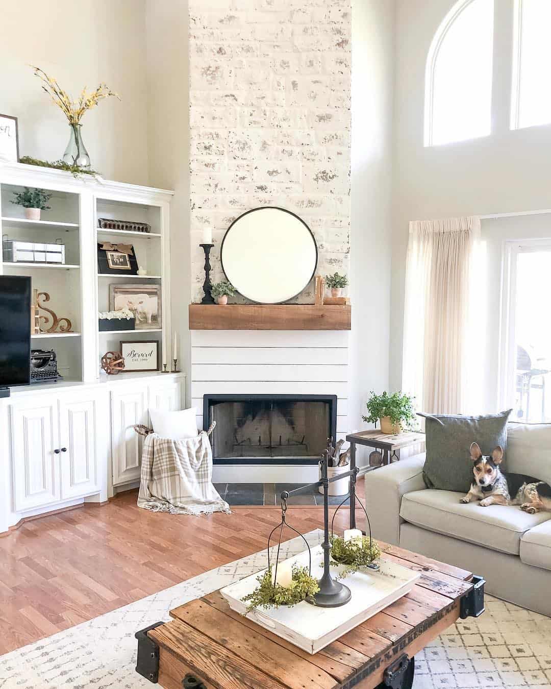 Tall Whitewashed Fireplace with Rustic Coffee Table - Soul & Lane