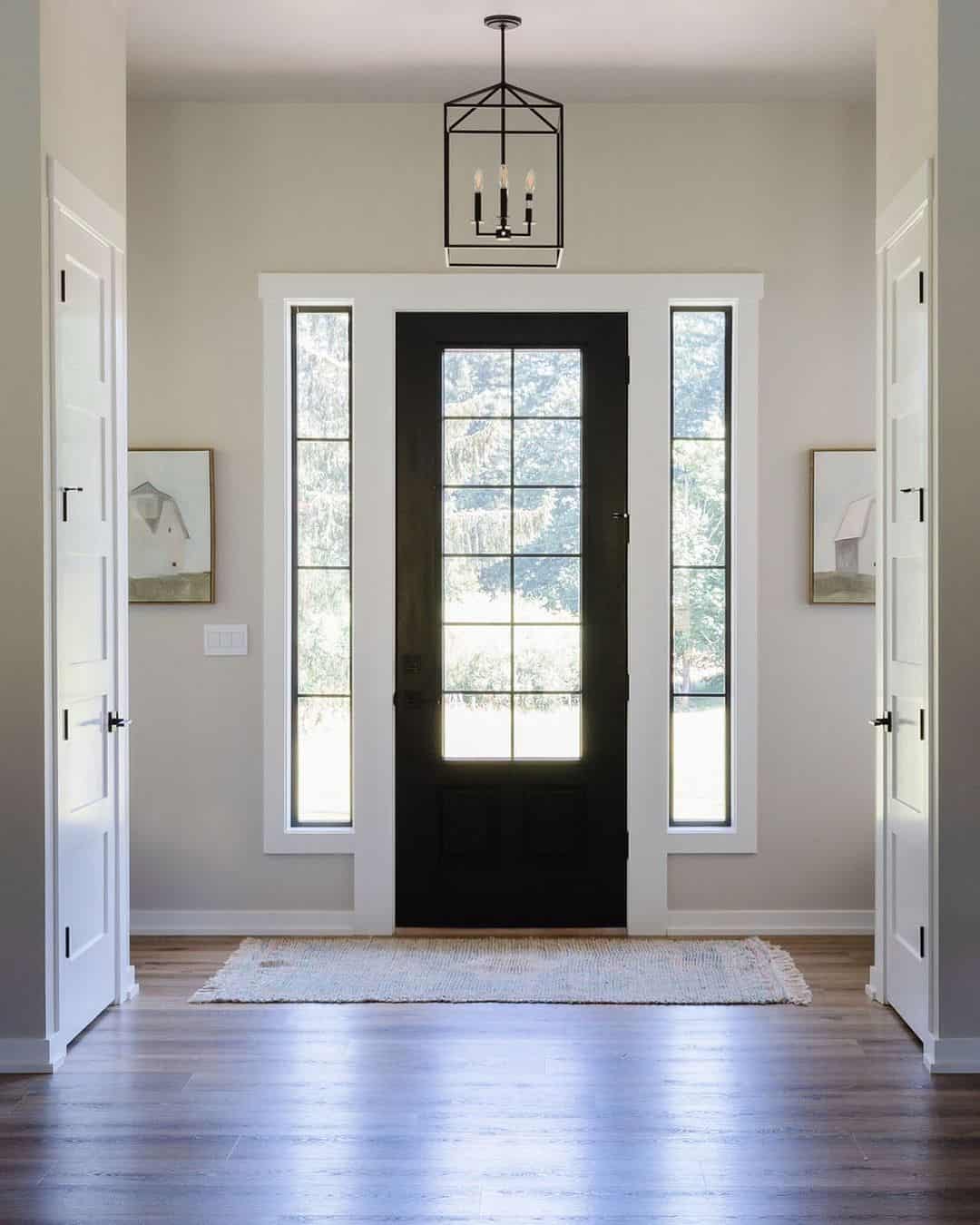 White Entryway with Black Door and Entryway Chandelier - Soul & Lane