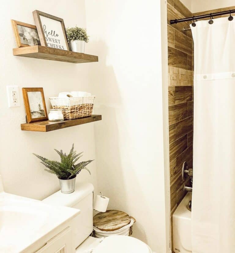 https://www.soulandlane.com/wp-content/uploads/2023/01/White-Bathroom-with-Floating-Shelves-Over-Toilet-768x826.jpg