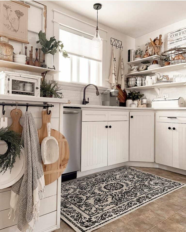 https://www.soulandlane.com/wp-content/uploads/2023/01/White-Beadboard-Kitchen-Cabinets-with-Black-Hardware-768x956.jpg