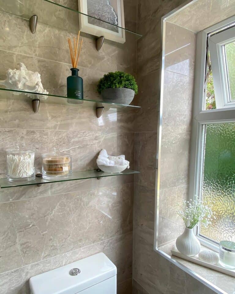 https://www.soulandlane.com/wp-content/uploads/2023/05/Decor-Ideas-for-Glass-Bathroom-Shelves-768x960.jpg