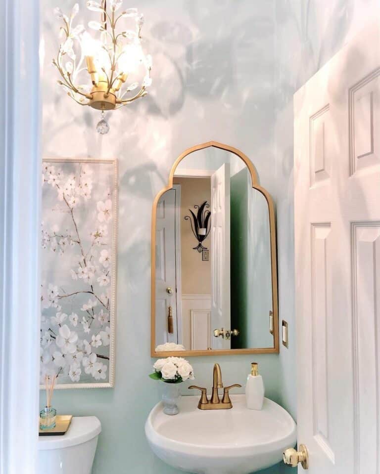 https://www.soulandlane.com/wp-content/uploads/2023/05/Whimsical-Bathroom-Design-With-Gold-Accessories-768x959.jpg